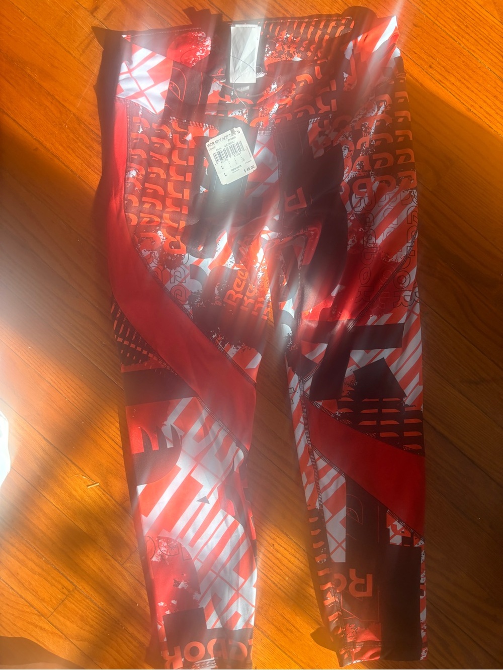 Reebok women Orange/black Graphic Leggings